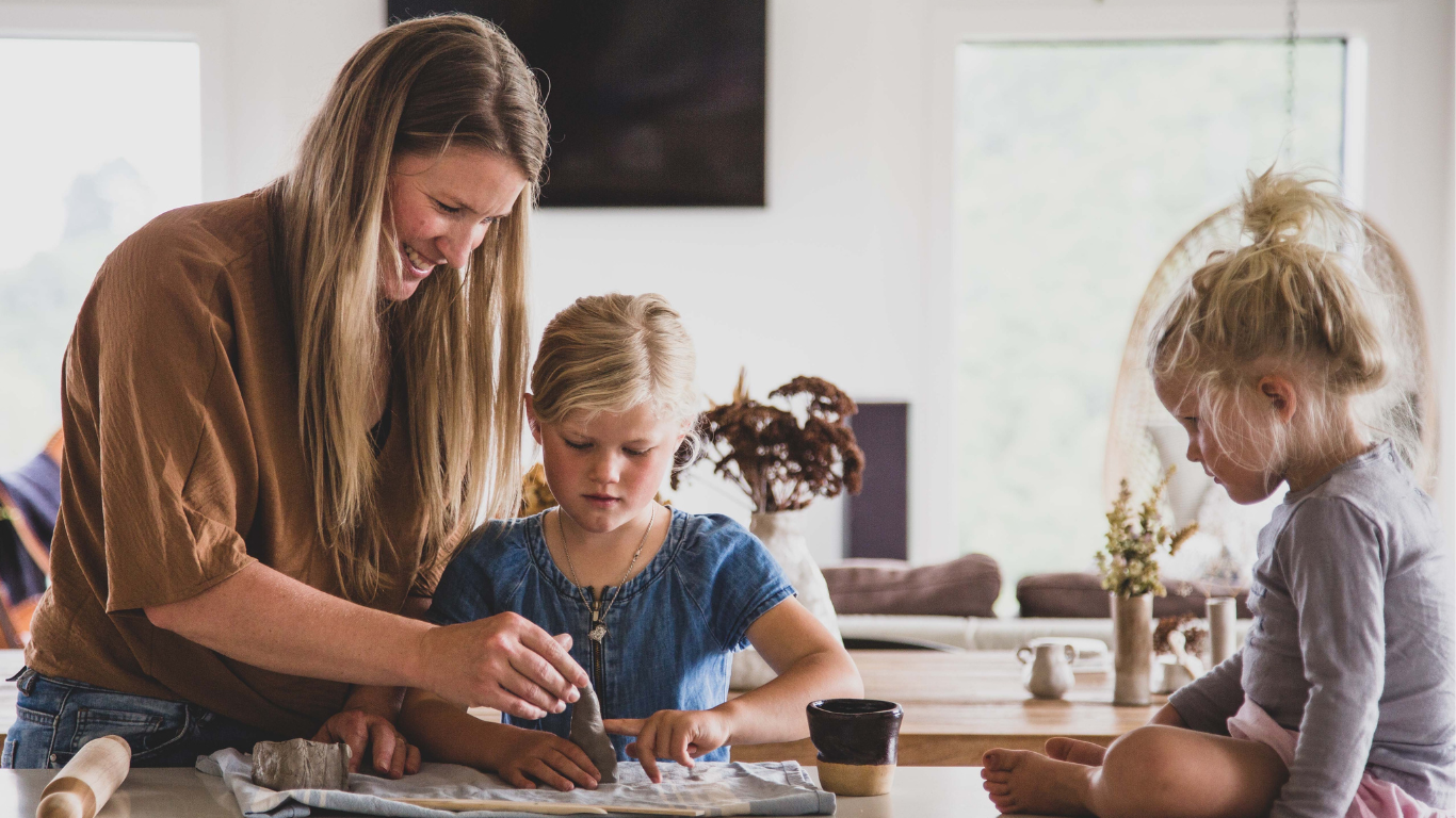 A family creating air dry animals together using a clay play kit