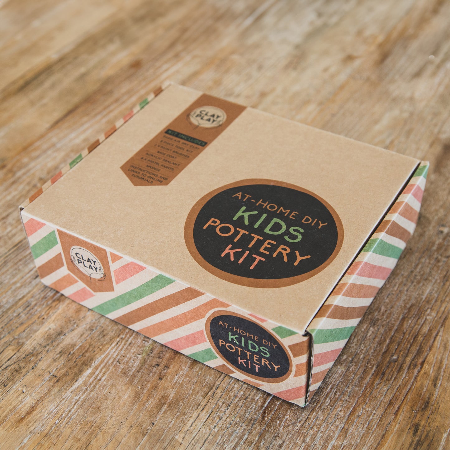 Packaging box for Kids Airdry Clay Kit with branding and colorful geometric patterns.
